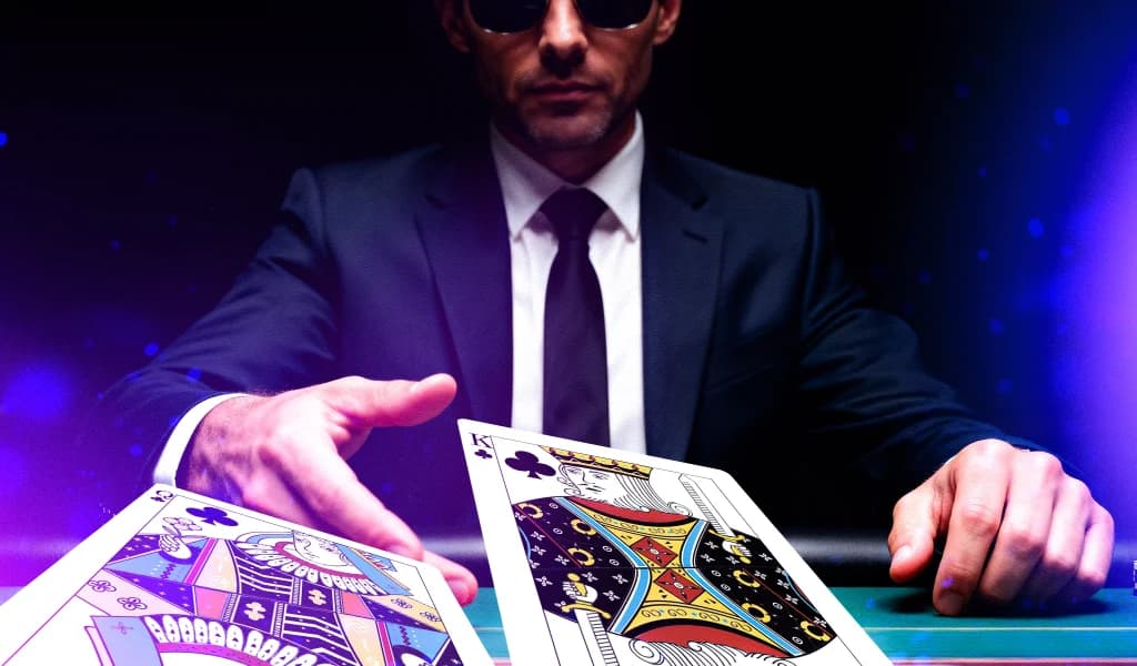 Poker player folding pocket kings at the table under neon light, symbolizing smart play and control.