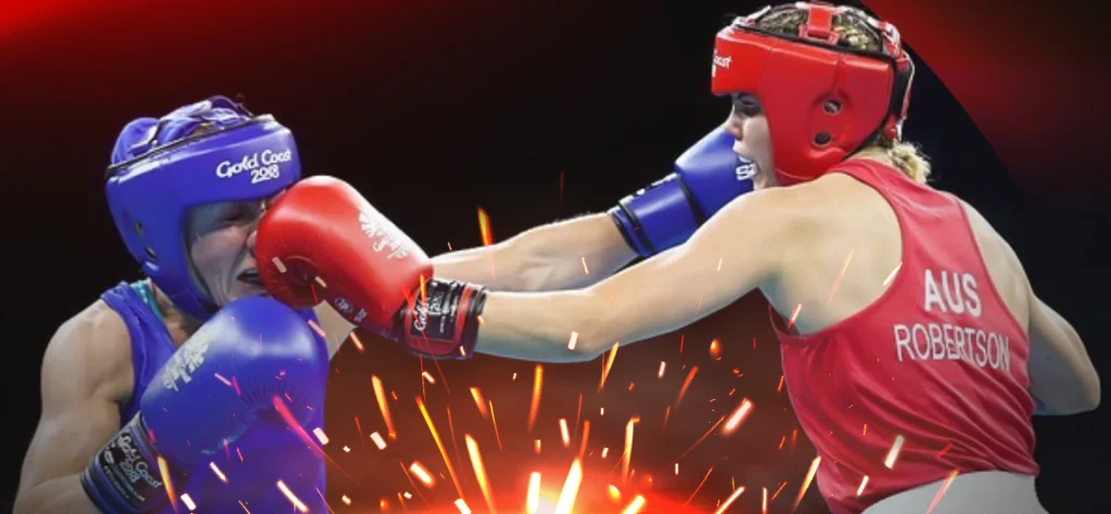 Taylah Robertson hitting her opponent in the face in the boxing ring wearing red gloves and headgear