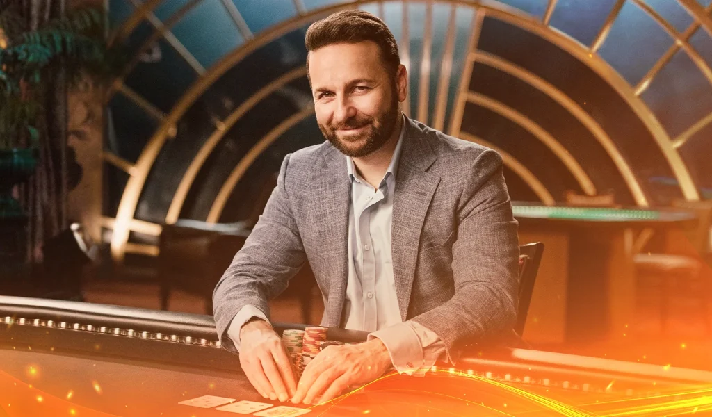 Daniel Negreanu in a suit at a poker table, smiling confidently with stacks of chips and cards in a luxurious setting.