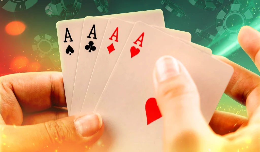 A close-up of a hand holding four aces against a glowing casino backdrop with floating poker chips and sparks of light.