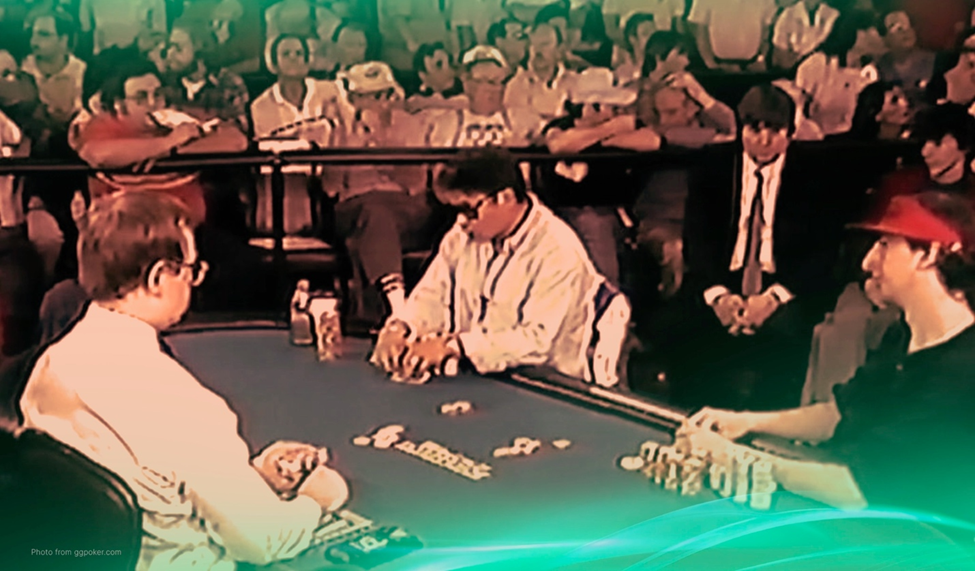 Vintage poker scene with Johnny Chan seated at a table, stacks of chips in play, and an audience watching the intense match.